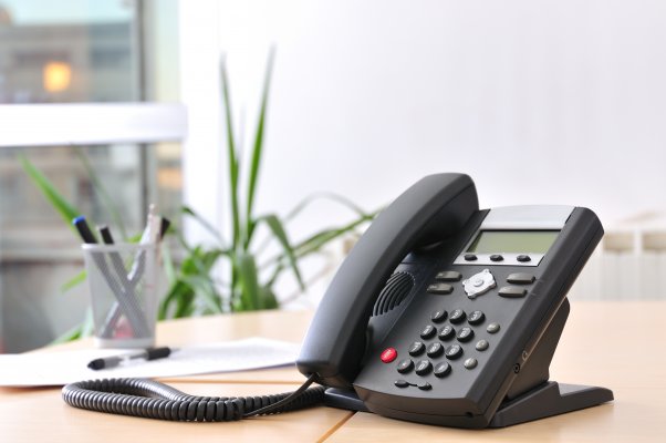 axvoice review voip service voip phone in office on desk 